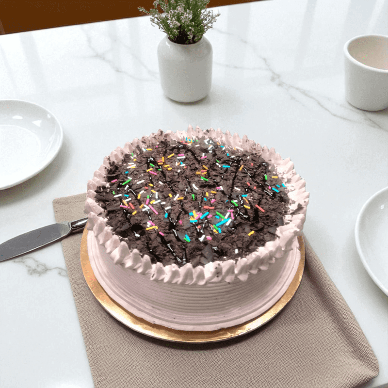 Sparkling Choco Sprinkle Fantasy Cake topped with chocolate shavings