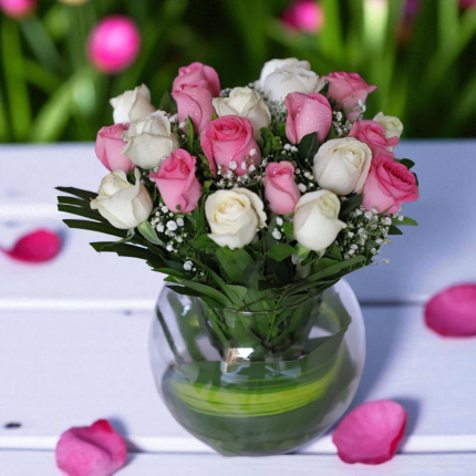Pink and white rose vase arrangement with greenery and fillers