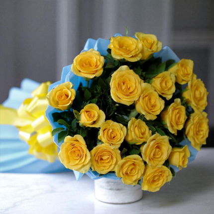 20 yellow roses bouquet in sky blue wrapping paper