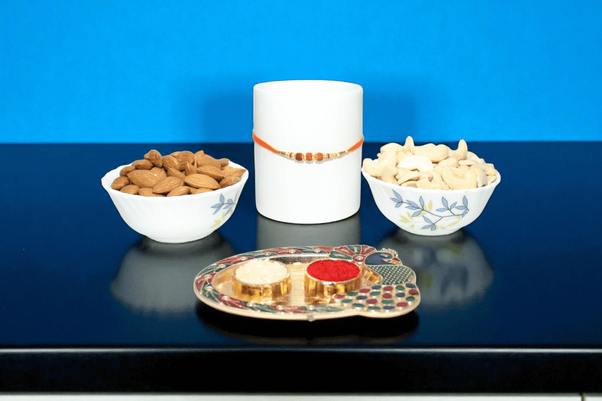sacred Rudraksha Rakhi paired with a premium dry fruit combo - YHOJA.COM