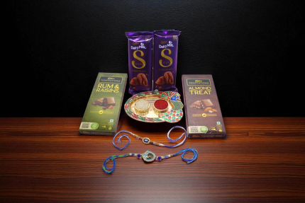 evil eye rakhi a Krishna rakhi – a symbol of love, 2 Cadbury Temptations (Rum & Raisins + Almond Treat) and 2 Dairy Milk Silk bars, - YHOJA.COM