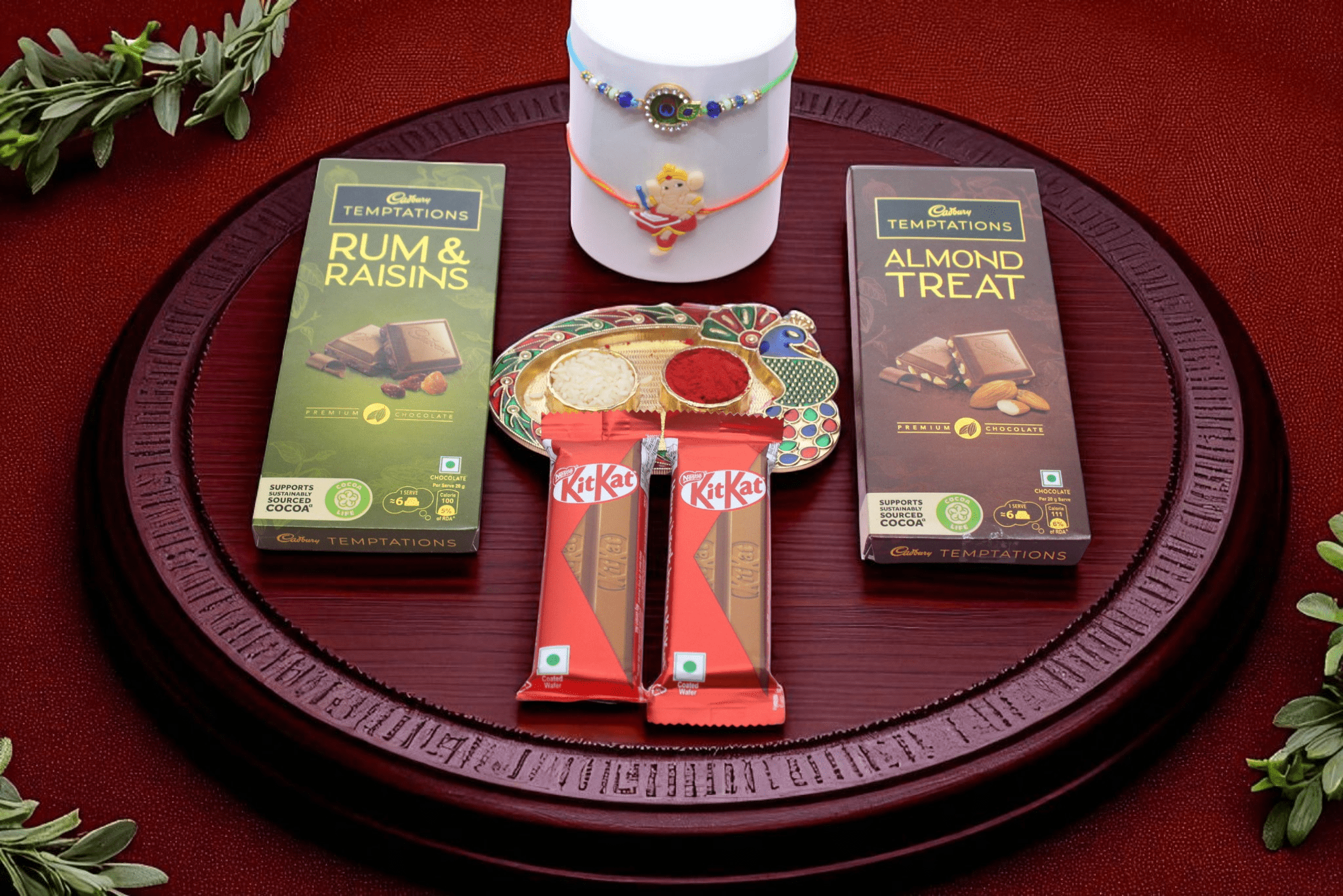 Rakhi With Chocolate A premium Evil Eye Rakhi, Two indulgent Cadbury Temptations Chocolates, Two Kitkat Bars