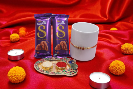 a spiritually charged Rudraksh Rakhi with dairy milk silk chocolate