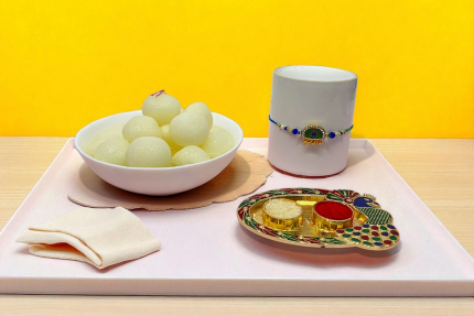 Peacock Rakhi with Classic Rasgulla Delight Box. YHOJA.COM