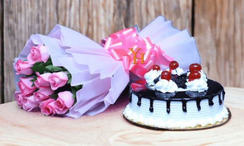 Pink Roses with Black Forest Cake combo featuring bouquet of pink roses and fresh cake with cherries.